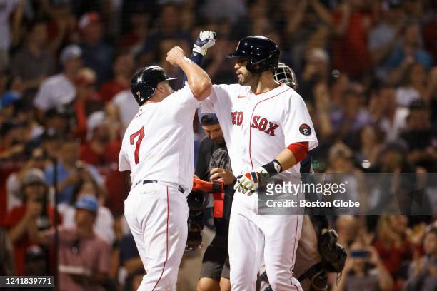 Boston Red Sox catcher Christian Vazquez and Boston Red Sox designated hitter J.D. Martinez celebrate 2 runs to equalize at the bottom of the fifth...