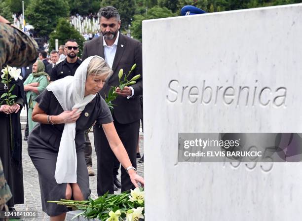 Dutch Defence Minister Kajsa Ollongren pays tribute to the victims of the 1995 Srebrenica massacre, during a mass burial at the memorial cemetery in...