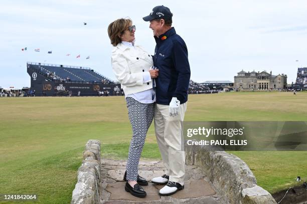 Winner of The Open in 1975 1980, 1982 ans 1983, US golfer Tom Watson and his wife LeslieAnne Wade pose for a photograph on the Swilcan Bridge, on the...