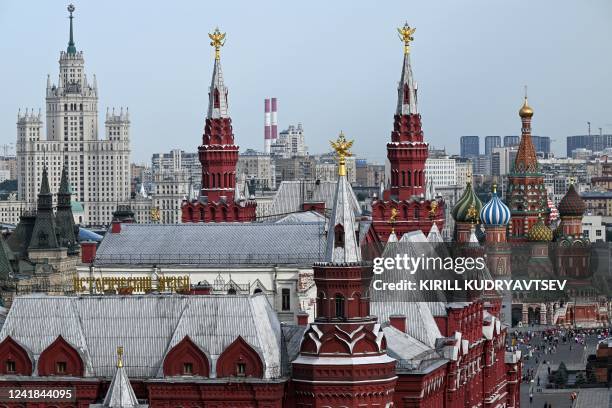 View shows the State Historical Museum , St Basil's Cathedral and one of the Stalin-era skyscrapers in downtown Moscow on July 11, 2022.