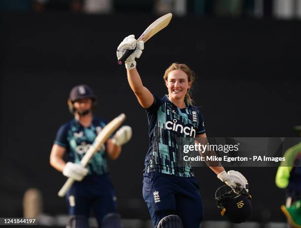 England's Emma Lamb celebrates her century during the first one day international match at The County Ground, Northampton. Picture date: Monday July...