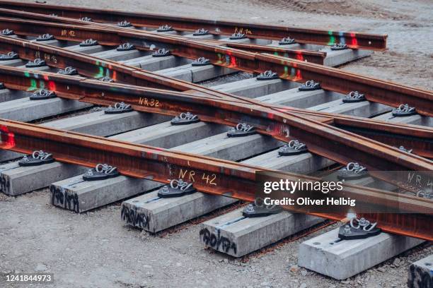 preconstructed tracks and switches for trams are ready for laying. there are numerous hand-written markings on the track sections. - rust germany photos et images de collection