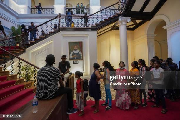 Thousands of people crowded the capital to take a look into the President's palace two days after protesters stormed into President's house in...