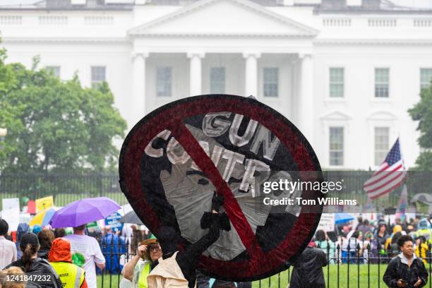 Sign in opposition to gun control is seen in Lafayette Square during the Womens March to the White House to call on the Biden Administration to...