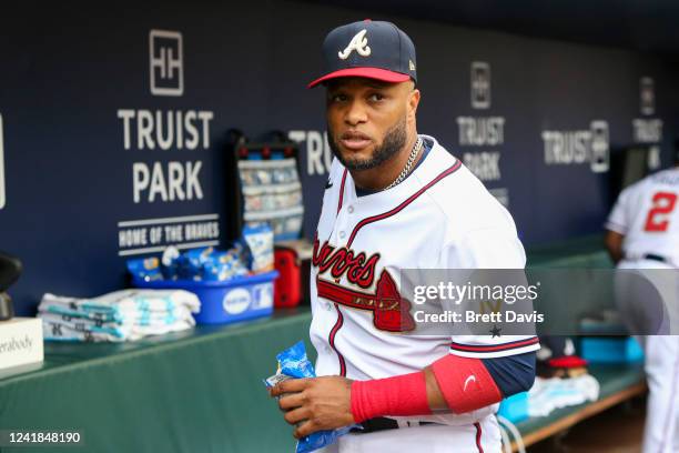Robinson Cano of the Atlanta Braves in the dugout before a game against the New York Mets at Truist Park on July 11, 2022 in Atlanta, Georgia.