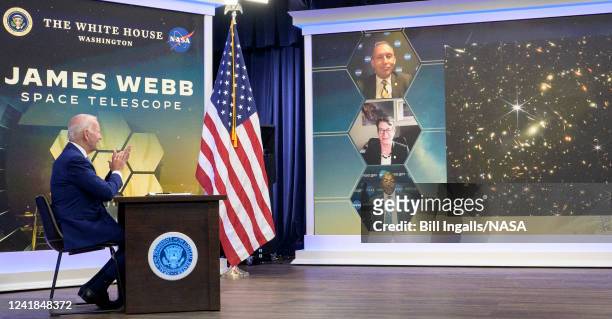 In this handout provided by the National Aeronautics and Space Administration , U.S. President Joe Biden previews the first full-color image from...
