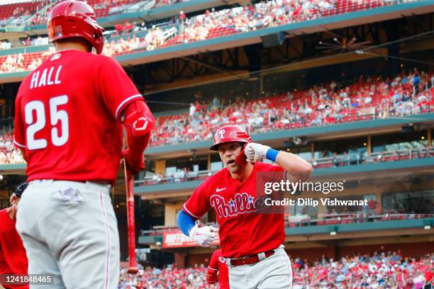 Rhys Hoskins of the Philadelphia Phillies celebrates after hitting a home run against the St. Louis Cardinals in the first inning at Busch Stadium on...