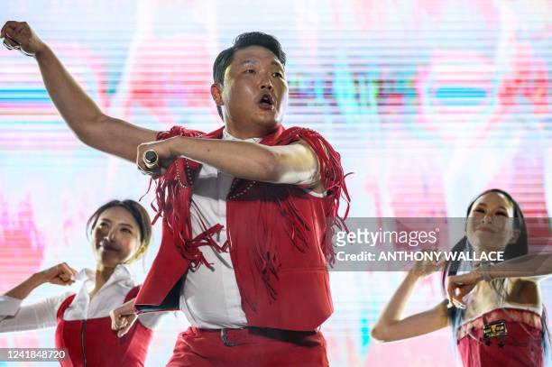 In this picture taken on May 27 South Korean rapper Psy performs his song "Gangnam Style" during an outdoor concert at the Korea University in Seoul....