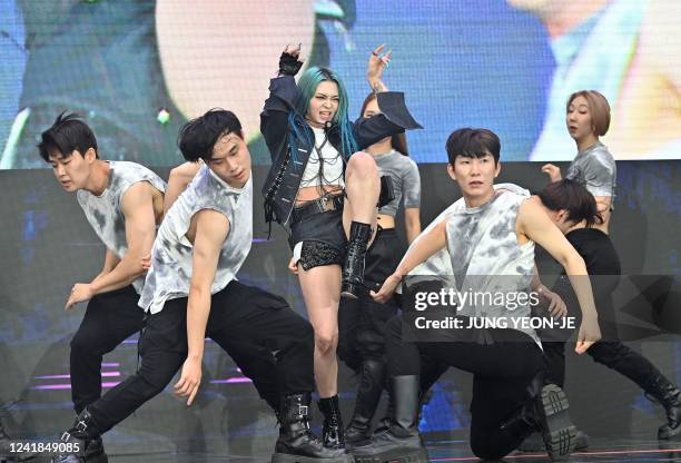 This picture taken on June 19, 2022 shows Korean American K-pop star AleXa performing on a stage before a red carpet event for the film 'Top Gun:...