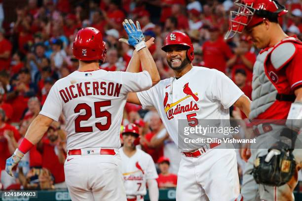 Albert Pujols of the St. Louis Cardinals celebrates with Corey Dickerson of the St. Louis Cardinals after Dickerson hit a two-run home run against...