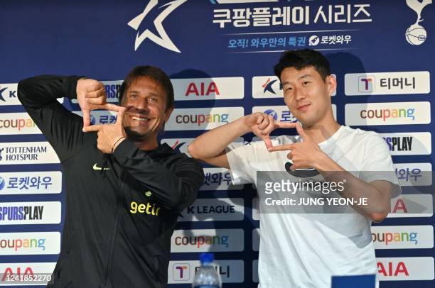 Tottenham Hotspur's South Korean striker Son Heung-min and head coach Antonio Conte pose for a photo during a pre-match press conference ahead of the...