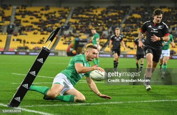 Wellington , New Zealand - 12 July 2022; Jordan Larmour of Ireland scores his second and his side's fourth try during the match between the Maori All...