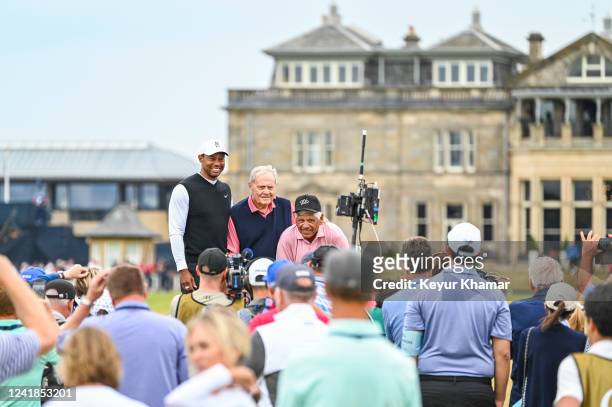 Tiger Woods, Jack Nicklaus and Lee Trevino smile as they pose for pictures on the Swilken Bridge on the 18th hole during the Celebration of Champions...