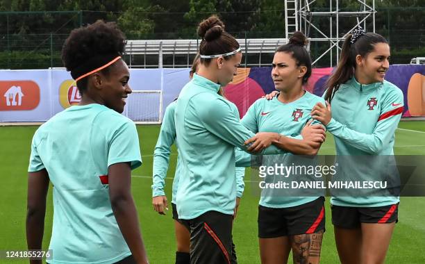 Portugal's striker Diana Silva , Portugal's striker Ana Borges and Portugal's defender Catarina Amado attend a team training session at Manchester...