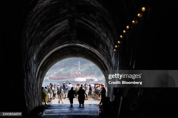 Tourists visit The Tunnel at the Niagara Parks Power Station in Niagara Falls, Ontario, Canada, on Sunday, July 10, 2022. The former Canadian Niagara...