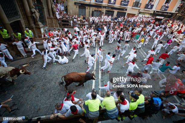 Aerial view of the bulls from the livestock of Jandilla passing through the town hall square in the sixth day of the running of the bulls in San...