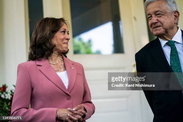 Vice President Kamala Harris looks at President Andrés Manuel López Obrador of Mexico outside the Vice Presidents residence at Naval Observatory on...