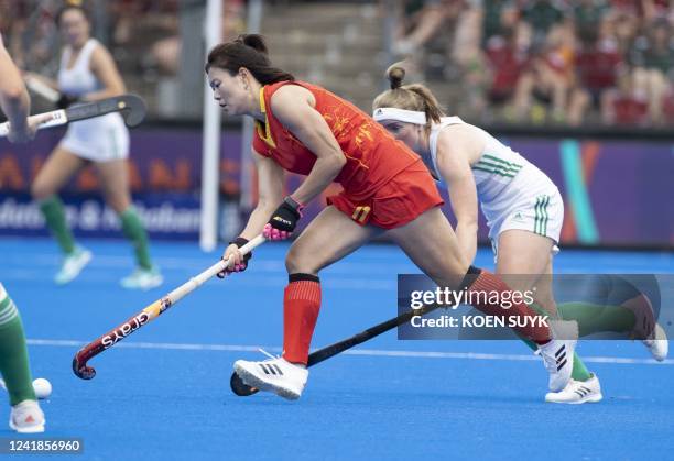 China's Jiaqi Zhong runs with the ball during the women's FIH World Cup field hockey match between China and Chile at Wagener Stadium, in Amsterdam,...