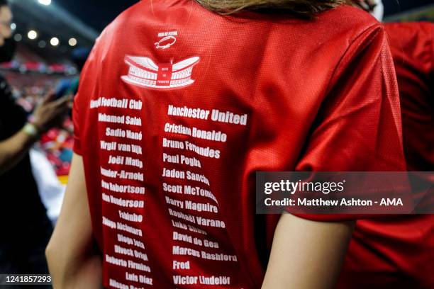 Merchandise match day t-shirt worn by a fan showing the team line ups during the preseason friendly match between Liverpool and Manchester United at...