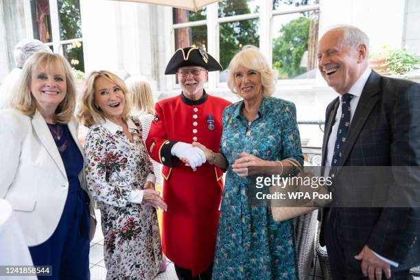 Camilla, Duchess of Cornwall poses with Twiggy, Felicity Kendall and Gyles Brandreth as the Duchess celebrates her 75th birthday at a lunch, hosted...