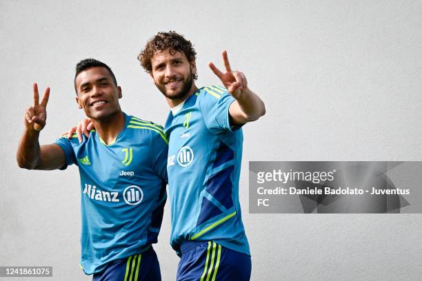 Alex Sandro and Manuel Locatelli pose during a training session at JTC on July 12, 2022 in Turin, Italy.