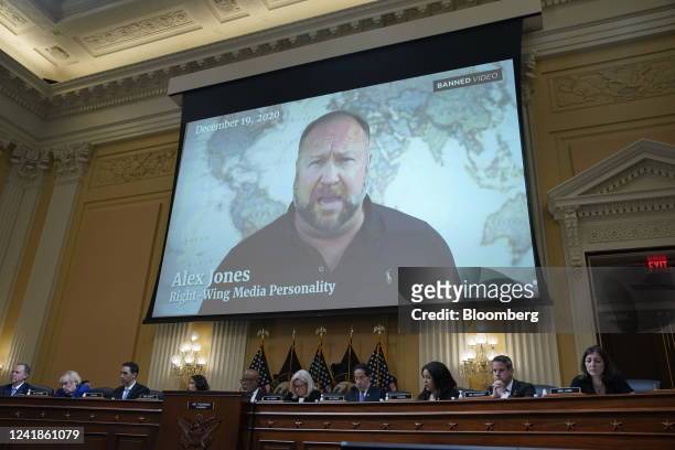 Video of Alex Jones, radio host and creator of the website InfoWars, is played on a screen during a hearing of the Select Committee to Investigate...