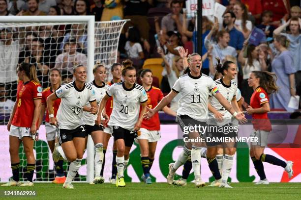 Germany's striker Alexandra Popp celebrates scoring her team's second goal during the UEFA Women's Euro 2022 Group B football match between Germany...