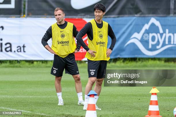 Mario Goetze of Eintracht Frankfurt and Daichi Kamada of Eintracht Frankfurt look on during the Eintracht Frankfurt Pre-Season Training Session on...