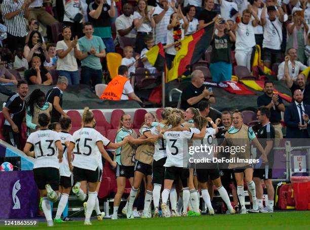 Alexandra Popp of Germany celebrates after scoring her team's second goal with teammates during the UEFA Women's Euro England 2022 group B match...