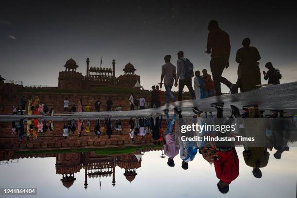 Visitors at Red Fort on a rainy day on July 12, 2022 in New Delhi, India. Heavy rain lashes several parts of Delhi-NCR on Tuesday, raising concerns...