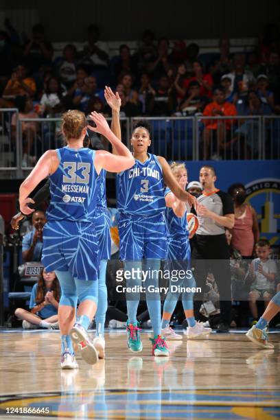 Candace Parker of the Chicago Sky high fives teammates during the game against the Atlanta Dream on July 12, 2022 at the Wintrust Arena in Chicago,...