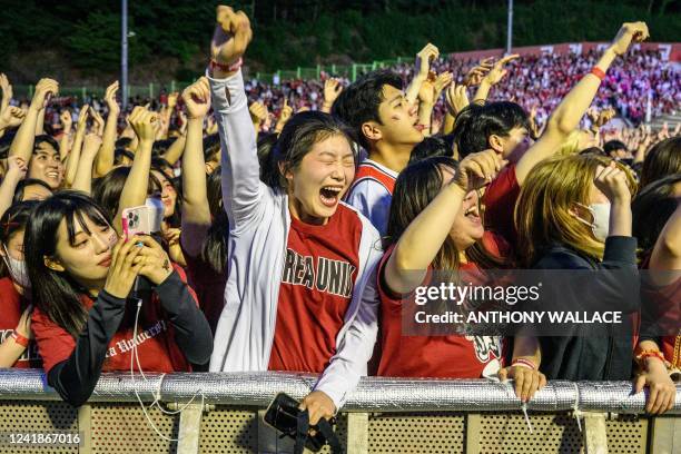 In this picture taken on May 27 fans react as they attend a concert by South Korean rapper Psy at the Korea University in Seoul. Newcomers to the...
