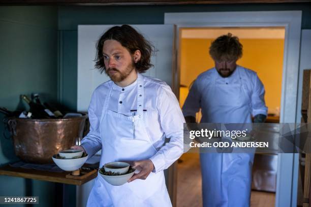 Double-Michelin-starred Faroese chef of KOKS restaurant Poul Andrias Ziska serves "Bog Labrador tea with lovage parfait" at the restaurant housed in...