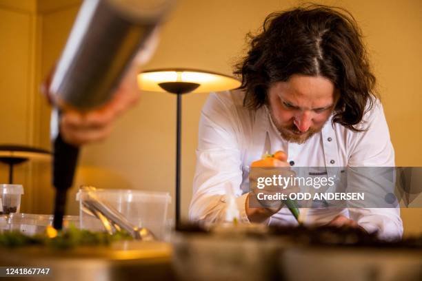 Double-Michelin-starred Faroese chef of KOKS restaurant Poul Andrias Ziska prepares food at the kitchen of the restaurant housed in the Poul Egedes...