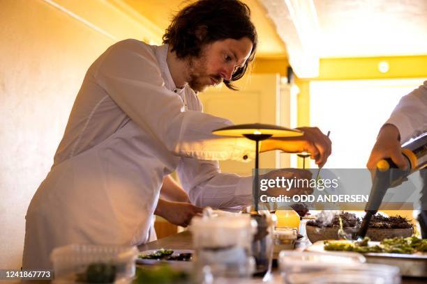 Double-Michelin-starred Faroese chef of KOKS restaurant Poul Andrias Ziska prepares food at the kitchen of the restaurant housed in the Poul Egedes...