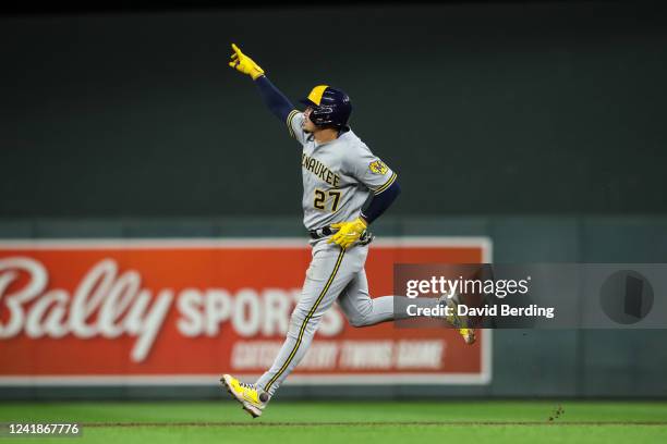 Willy Adames of the Milwaukee Brewers celebrates his two-run home run as he rounds the bases against the Minnesota Twins in the fifth inning of the...