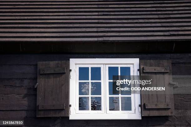 Picture taken on June 28, 2022 shows a window t Poul Egedes House, housing the KOKS restaurant of double-Michelin-starred Faroese chef Poul Andrias...