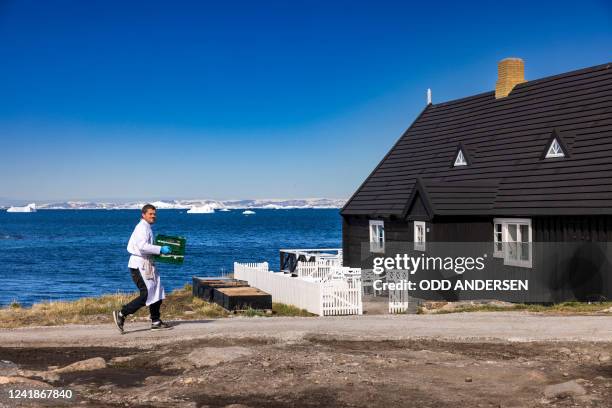 Chef from the KOKS restaurant of double-Michelin-starred Faroese chef Poul Andrias Ziska carries supplies into the restaurant housed in the Poul...