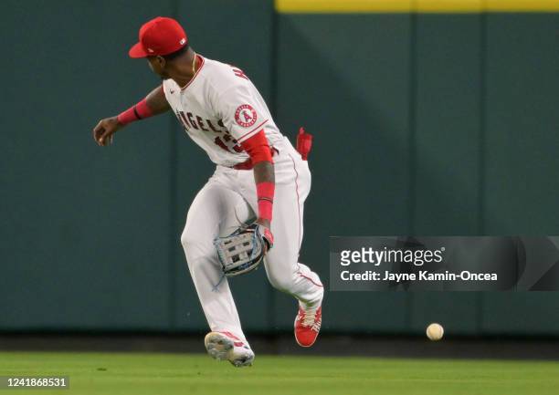 Monte Harrison of the Los Angeles Angels commits a two-run error on a ball off the bat of Jose Altuve of the Houston Astros in the sixth inning at...