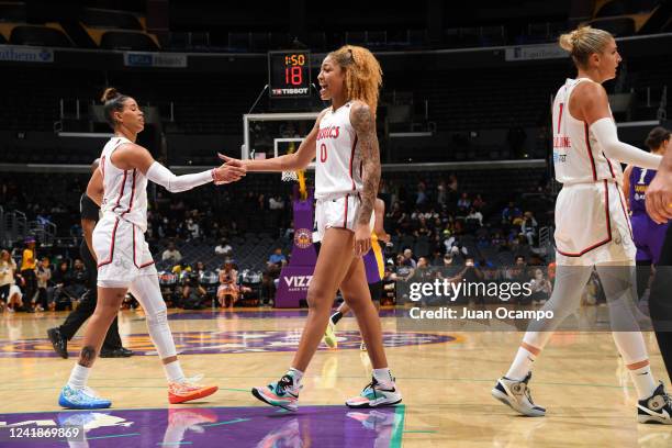 Natasha Cloud of the Washington Mystics high five Shakira Austin during the game against the Los Angeles Sparks on July 12, 2022 at Crypto.com Arena...