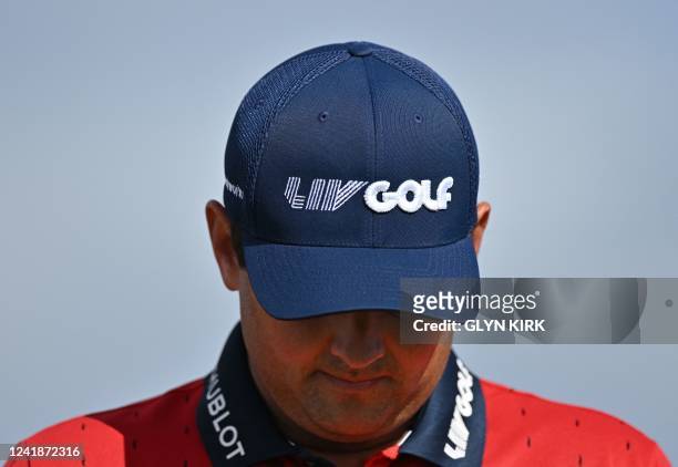 Golfer Patrick Reed wears a LIV Golf branded cap and shirt during a practice round for The 150th British Open Golf Championship on The Old Course at...