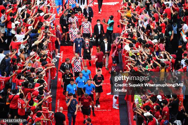 Virgil van Dijk of Liverpool signs autographs for fans during the preseason friendly match between Liverpool and Machester United at Rajamangala...