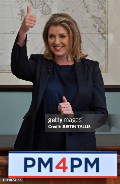 Conservative MP and Britain's Minister of State for Trade Policy, Penny Mordaunt, makes a thumbs-up gesture during the launch her campaign to become...