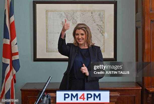 Conservative MP and Britain's Minister of State for Trade Policy, Penny Mordaunt, makes a thumbs-up gesture during the launch her campaign to become...