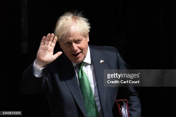 Britain's outgoing Prime Minister, Boris Johnson, leaves 10 Downing Street to attend Prime Minister's Questions in the House of Commons on July 13,...