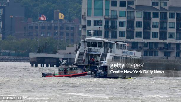 July 12: NYPD and FDNY Scuba dive teams and a NY Waterway Ferry are pictured near the boat accident on the Hudson River Tuesday afternoon. A least 3...