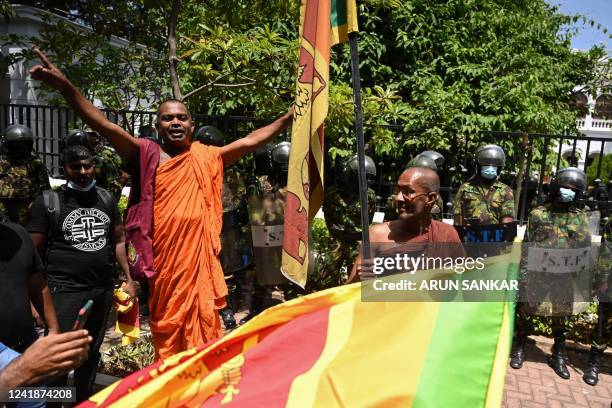 Buddhist monks demonstrate during an anti-government protest outside the office of Sri Lanka's prime minister in Colombo on July 13, 2022. -...