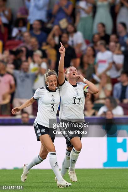 Alexandra Popp of Germany celebrates after scoring her sides first goal during the UEFA Women's Euro England 2022 group B match between Germany and...