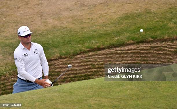 Golfer Zach Johnson plays from a bunker on the 17th during a practice round for The 150th British Open Golf Championship on The Old Course at St...