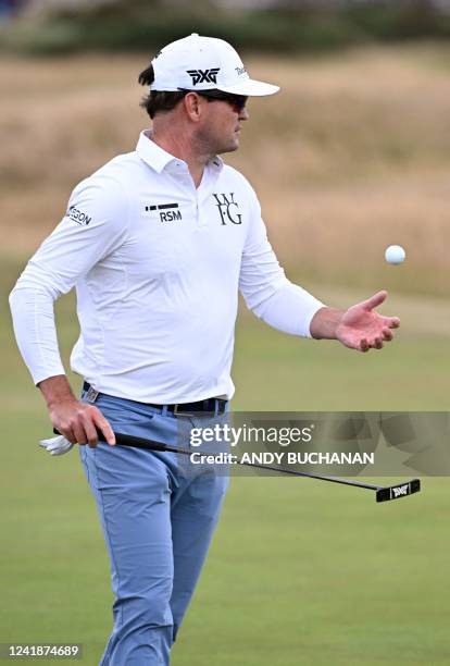 Golfer Zach Johnson walks across the 16th green during a practice round for The 150th British Open Golf Championship on The Old Course at St Andrews...